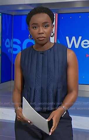 Zinhle's navy pleated peplum top on NBC News Daily