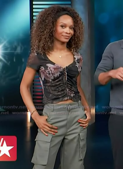 Zuri's black floral print top and cargo pants on Access Hollywood