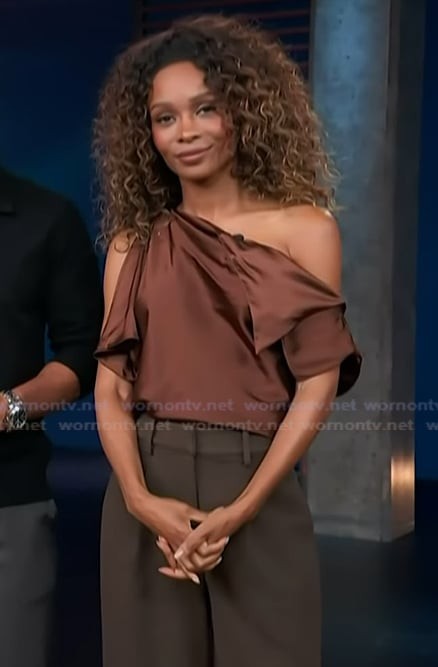 Zuri's brown satin off shoulder top on Access Hollywood
