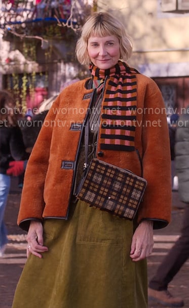 Anne's orange fleece jacket and green cord midi skirt on The Four Seasons