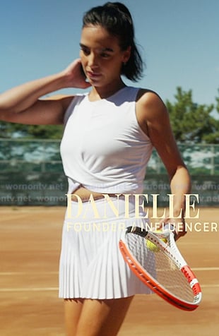 Danielle's whtie cross cropped top and pleated teniss skirt on In The City