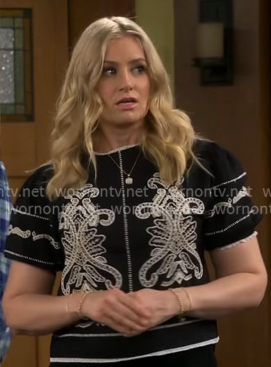 Gemma's black and white embroidered top on The Neighborhood