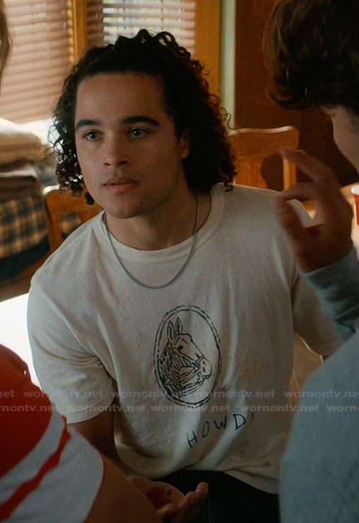 John's beige horse graphic tee on Off Campus