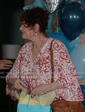 Sue Blevins's floral print v-neck top on 9-1-1