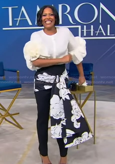 Tamron's white ruffle sleeve top and pants on Tamron Hall Show