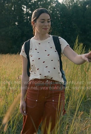 Annie's white labybug print tee and red pants on Sweet Magnolias
