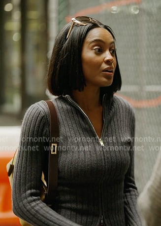 Ciara's grey ribbed zip sweater and plaid sheer skirt on In The City