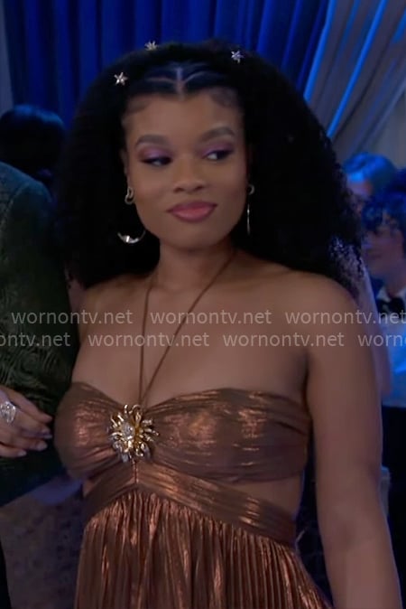 Eva's bronze dress with cutouts on Beyond the Gates