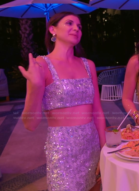 Janet's silver metallic crop top and skirt on The Valley