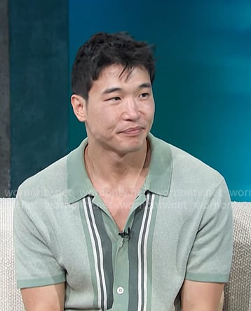 Joel Kim Booster's greens stripe knit shirt on Access Hollywood