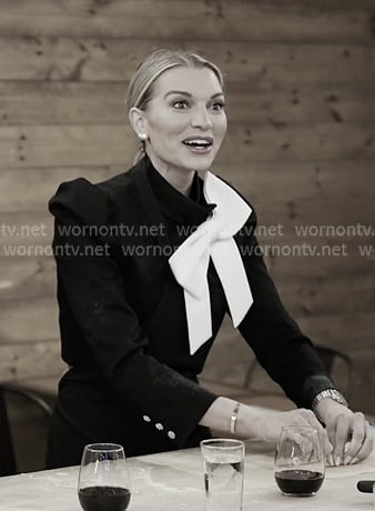 Lindsay's black jacket with white bow on In The City