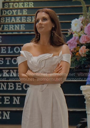 Maddie's white floral top and wide-leg pants on Sweet Magnolias