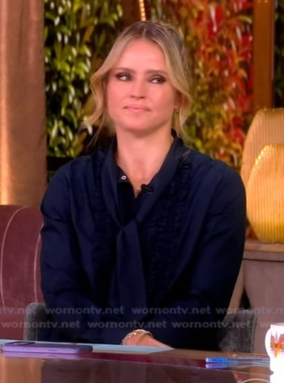 Sara's navy tie neck blouse on The View