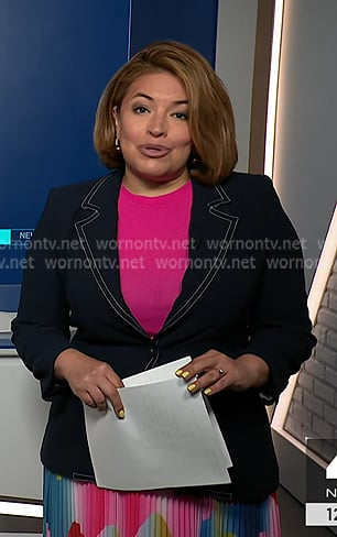 Gilma's navy stitching blazer and print pleated skirt on NBC News Daily
