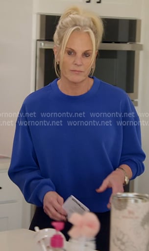 Kristi's blue sweatshirt on The McBee Dynasty Real American Cowboys