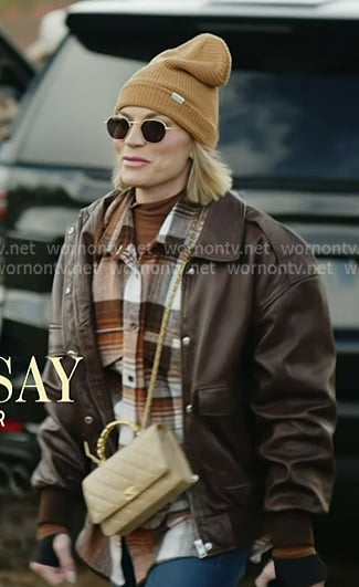Lindsay's brown plaid shirt and leather jacket on In The City