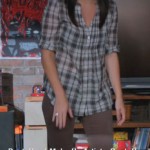 Penny’s check shirt and brown pants on Happy Endings