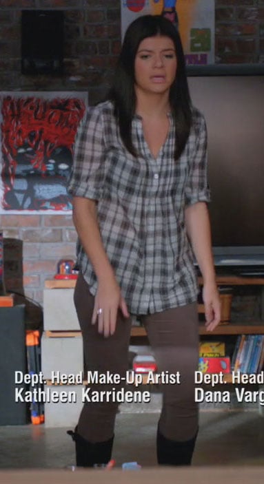 Penny’s check shirt and brown pants on Happy Endings