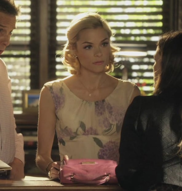 Lemon’s cream and purple floral dress and pink handbag on Hart of Dixie