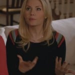 Alex’s black sweater with colored stripes on the shoulder on Happy Endings