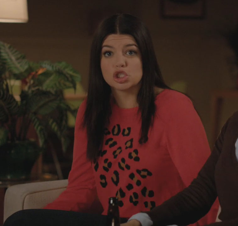 Penny’s orange sweater with leopard spots on Happy Endings