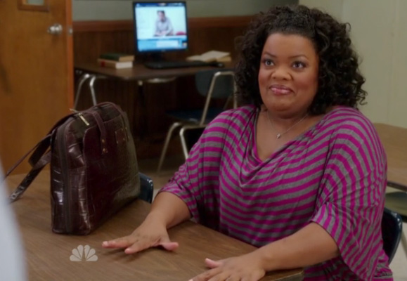 Shirley’s pink striped top and leather handbag on Community