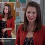 Annie’s black floral dress and orange cardigan on Community