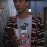Abed’s grey penguin with a camera shirt on Community