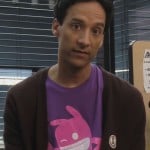 Abed’s purple shirt with pink character on it on Community