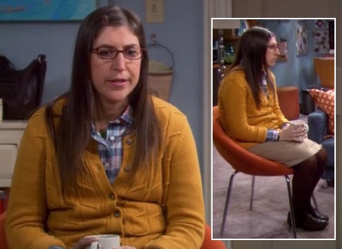Amy’s yellow knit cardigan with brown tights on The Big Bang Theory