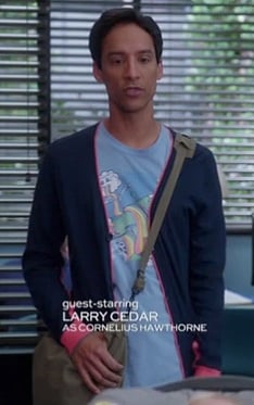 Abed’s light blue rainbow graphic shirt and navy/pink cardigan on Community