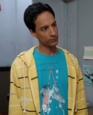 Abed’s blue shoe graphic shirt with yellow striped hoodie on Community