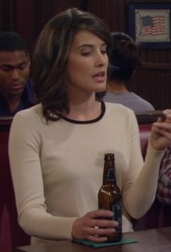 Robin’s cream longsleeve top with black neck trim on How I Met Your Mother