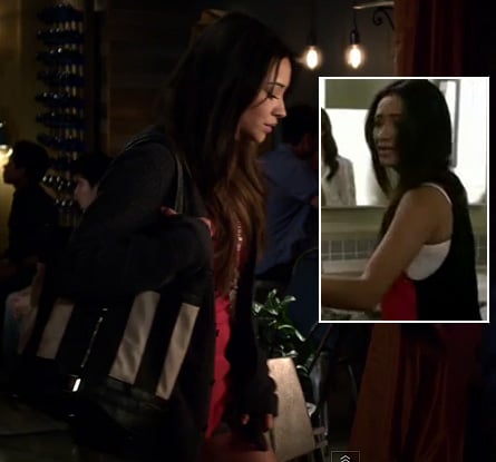Emily’s pink and black contrast back top with striped bag on Pretty Little Liars