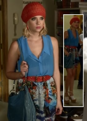 Hanna’s red knit beanie with blue sleeveless top and patterned skirt on Pretty Little Liars