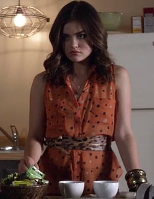 Aria’s orange polka dot top and leopard print belt on Pretty Little Liars