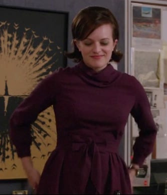 Peggy’s purple cowl neck dress with bow on Mad Men