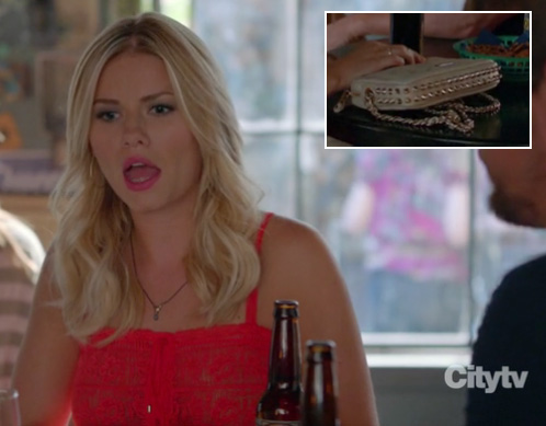 Alex’s red lace top and cream studded purse on Happy Endings