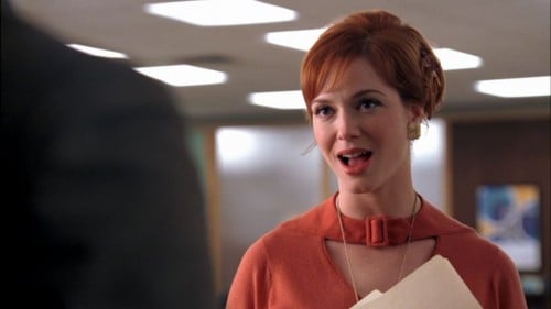 Joan's orange cutout top on Mad Men