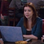 Lily’s teal blue blazer and blue floral laptop cover on How I Met Your Mother