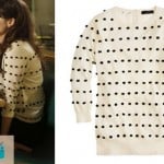 Jess’s white sweater with black polka dots/pom poms on New Girl