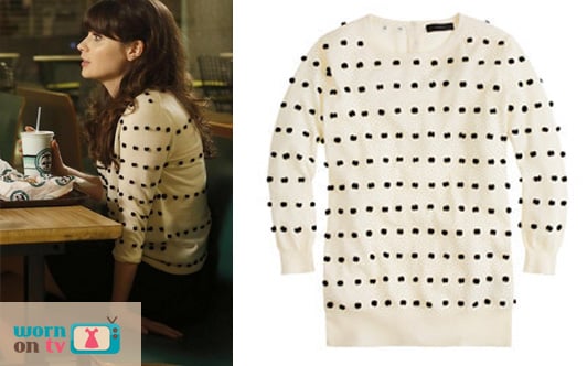 Jess’s white sweater with black polka dots/pom poms on New Girl