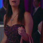 Penny’s purple patterned strapless dress and pink handbag on Happy Endings