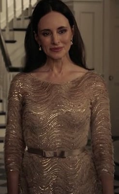 Victoria's gold dress with swirls and bow belt on Revenge