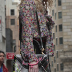 Carrie’s floral blouse with bow and black paint splatter bag on The Carrie Diaries