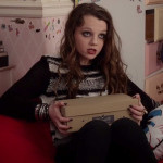 Dorrit’s black and white sweater on The Carrie Diaries