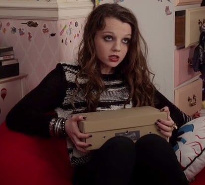 Dorrit Bradshaw's black and white sweater on The Carrie Diaries