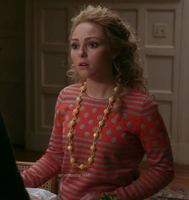 Carries coral/red polkadot and stripe sweater on The Carrie Diaries