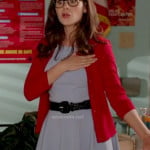 Jess’s pastel blue dress with red cardigan and black belt on New Girl