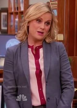 Leslie’s pink and red contrast trim blouse on Parks and Recreation